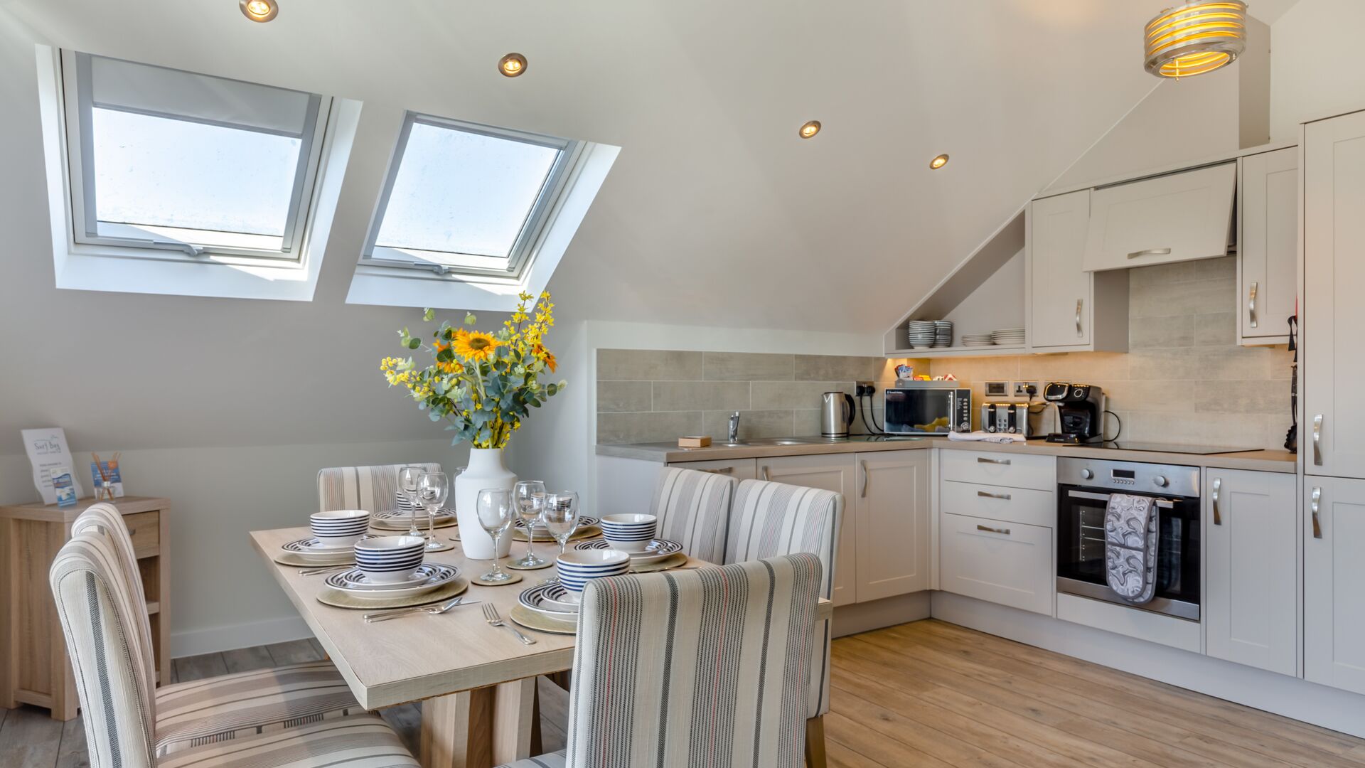 the kitchen and dining area in the Beachcomber apartment 